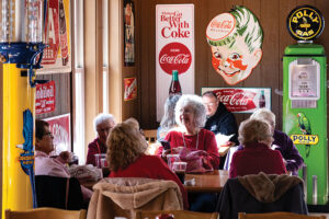 Visitors enjoy lunch at Cammack Station in Muncie, Indiana. Cammack Station is a stop on the Tenderloin Lovers Trail, which highlights the pok tenderloin sandwich, a beloved Midwestern dish.