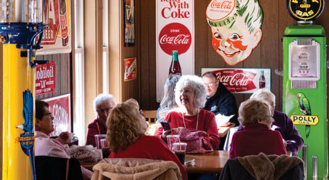 Visitors enjoy lunch at Cammack Station in Muncie, Indiana. Cammack Station is a stop on the Tenderloin Lovers Trail, which highlights the pok tenderloin sandwich, a beloved Midwestern dish.