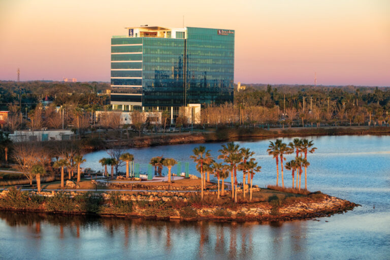 Dawn at the Riverfront Esplanade and Brown and Brown Insurance building in Daytona, FL