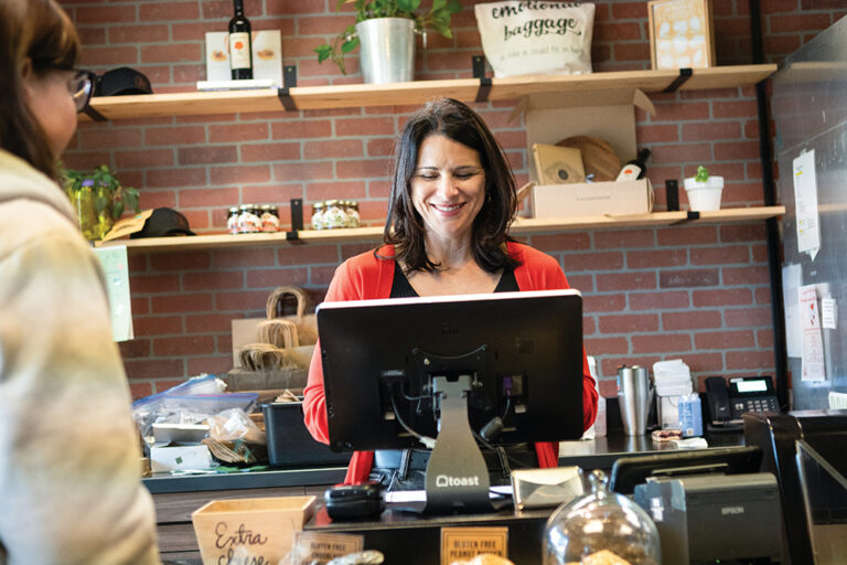 Krista Kintop Phillips, co-owner of The Cheese Board, takes an order inside their Midtown location in Reno, NV.