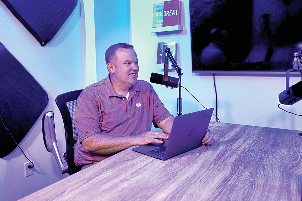 A man records a podcast at Achieve Entrepreneur & Coworking Center in Murfreesboro, TN.