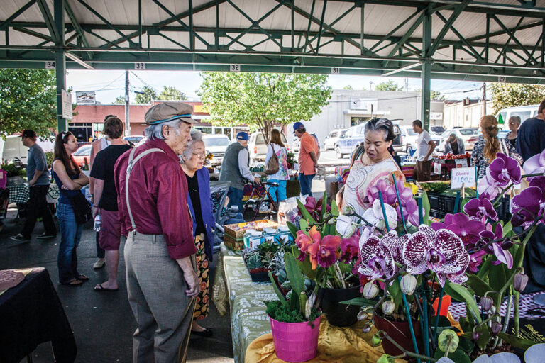 People shop at the Overland Park Farmers Market in Overland Park, KS.