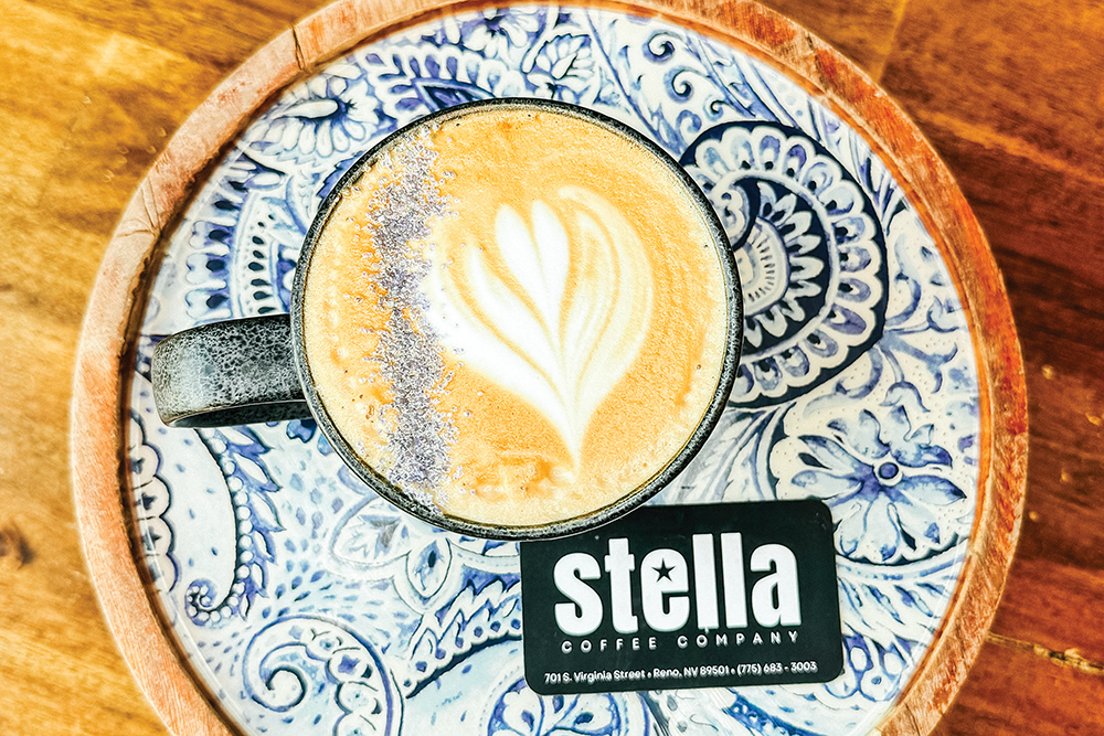 A latte on a decorative plate from Stella Coffee Company in Reno,, NV.