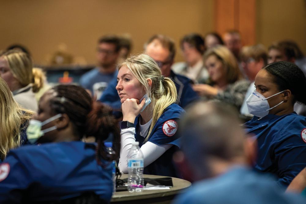Student listens at the Third Annual Delaware County Symposium on Substance Use Disorders