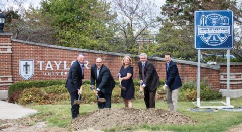 People participate in the groundbreaking for Main Street Mile Initiative