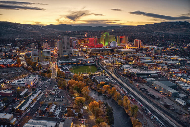 Downtown Reno, NV, lights up in color at dusk.