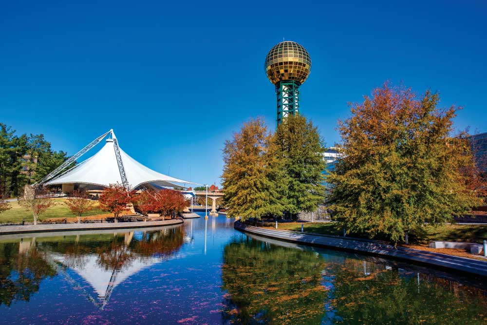 The Sunsphere, in Knoxville, Tennessee, is a 266 ft (81 m) high hexagonal steel truss structure, topped with a 75 ft (23 m) gold-colored glass sphere that served as the symbol of the 1982 World's Fair. Designed by the Knoxville architectural firm Community Tectonics, the Sunsphere was created as the theme structure for the 1982 World's Fair. It was noted for its unique design in several engineering publications. The World's Fair site later became a public park alongside Knoxville's official convention center and adjacent to the University of Tennessee's main campus. The Sunsphere remains standing directly across a man-made pond from the Tennessee Amphitheater, the only other structure remaining from the 1982 World's Fair.