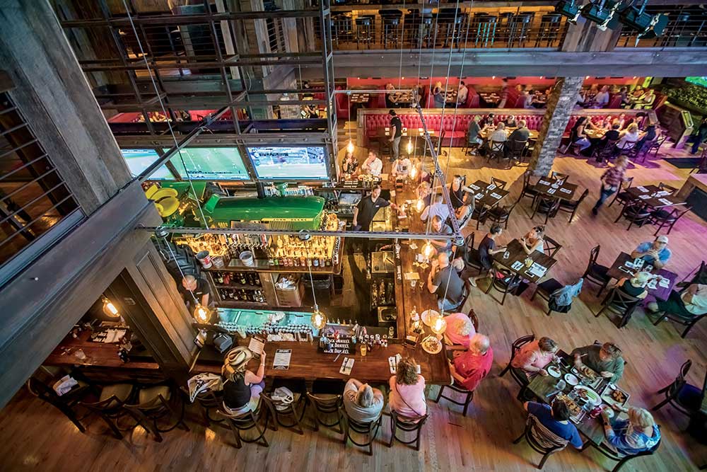 A tractor is the centerpiece of the main bar at Jason Aldean’s Kitchen and Roof Top Bar along lower Broadway in downtown Nashville, Tennessee.