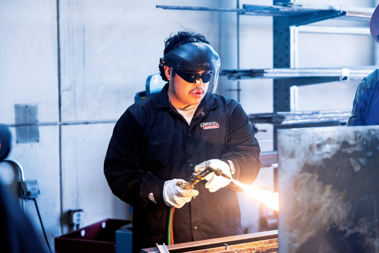 A young man learns to weld at Iowa Western Community College in Council Bluffs, IA.