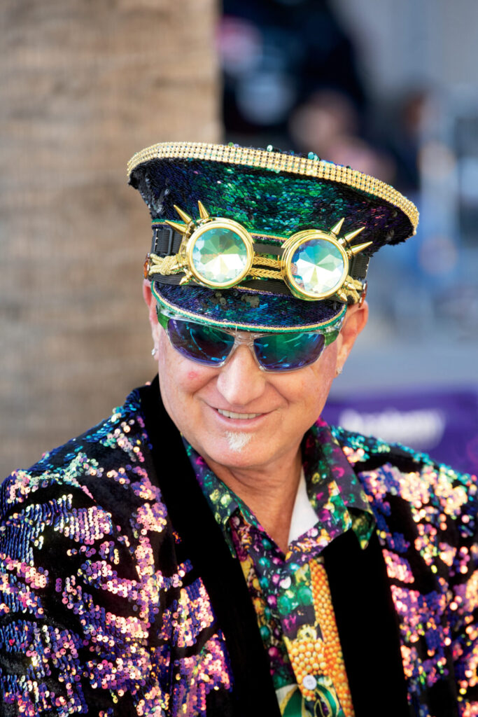 Benton Trouard dresses for Mardi Gras during a block party before the Krewe of Krewes Parade in downtown Lake Charles.