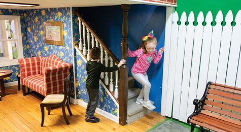 Kimber Jones, 6, plays in a child-sized doll house with Jaxton Tennant, 6, at the Oak Ridge Children's Museum in Oak Ridge, Tennessee.