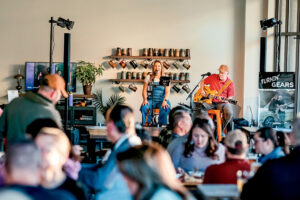 A feale singer and male guitarist perform at Full Fledged Brewing Co. in Council Bluffs, IA.