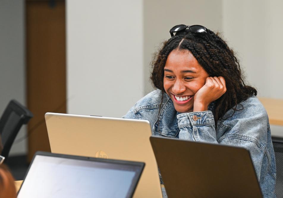 A student works in Entrepreneurship: The Mindset and Skillset class.
