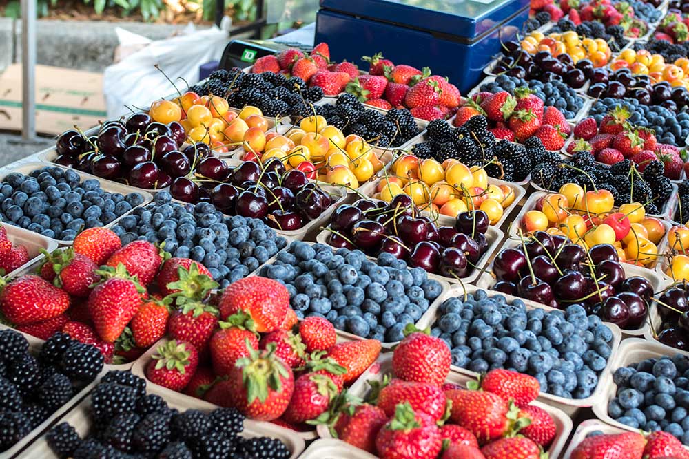 Local Grown Organic Fresh Berries and Cherries at Farmers Market. Fresh food and farmers markets in Tennessee are very important in the state.