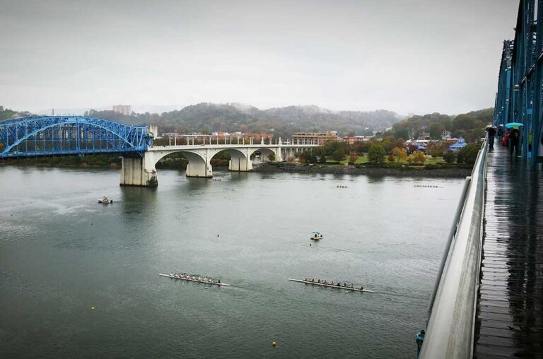 People row along the Tennessee River in Chattanooga, which has a huge rowing youth sports scene.