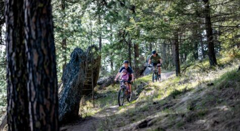 Colin Priebe, his child Alex, and Dominic MacIsaac bike on the Penstemon Path in Moscow, Idaho ©Journal Communications/Chiana McInelly