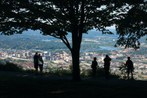 Visitors get an aerial view of downtown Chattanooga from Signal Point in Signal Mountain, TN. Chattanooga was recently named North America's first National Park City.