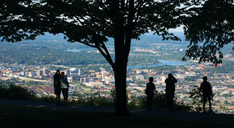 Visitors get an aerial view of downtown Chattanooga from Signal Point in Signal Mountain, TN. Chattanooga was recently named North America's first National Park City.