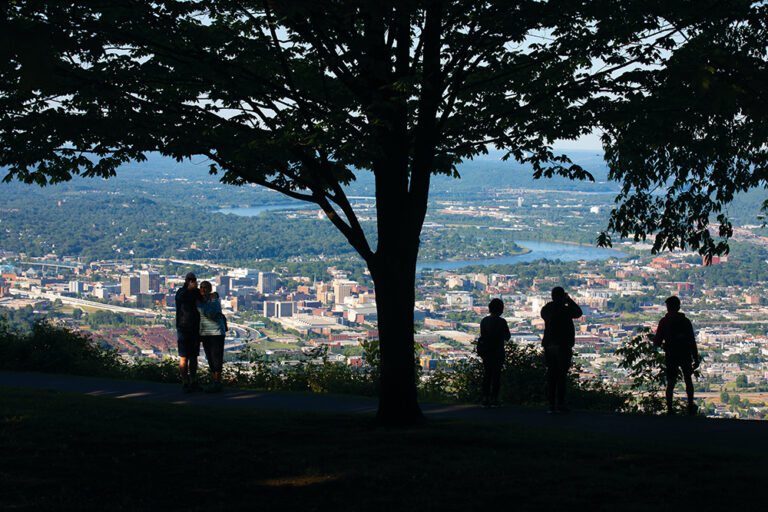 Visitors get an aerial view of downtown Chattanooga from Signal Point in Signal Mountain, TN. Chattanooga was recently named North America's first National Park City.