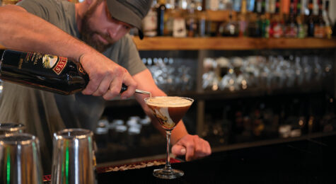 A bartender mixes a drink at The Chopping Block in downtown Pottsville, PA. It's among the must-try restaurants in Schuylkill County.