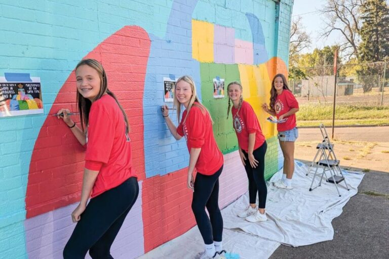 Montgomery County students paint a mural.