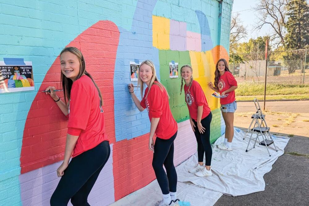 Montgomery County students paint a mural.