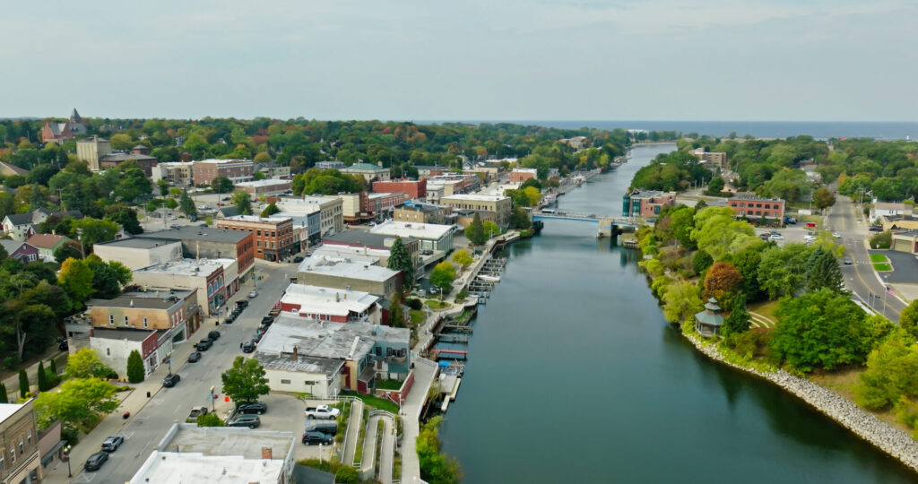 Aerial shot of Manistee, a small city in Manistee County in Southern Michigan on the shore of Lake Michigan on a clear day in Fall. Manistee is known as the "Salt City" due to its association with salt production.