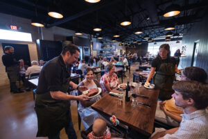 Adam Scianna serves customers at Prime & Pint in Columbia, TN.