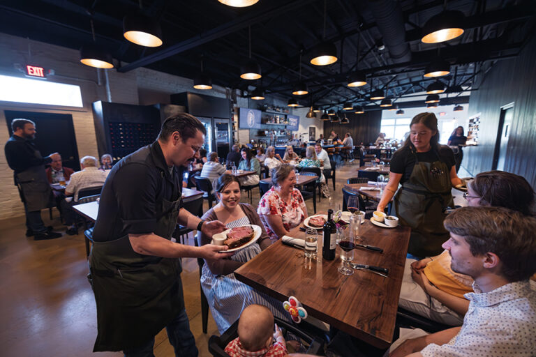 Adam Scianna serves customers at Prime & Pint in Columbia, TN.