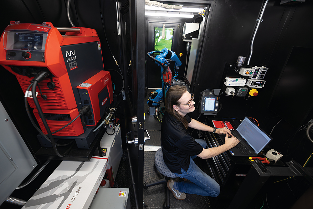 Employees program a Nomad Portable System at One-Off Robotics, which specializes in robotic metal additive manufacturing at the INCubator in Chattanooga, Tennessee. It's a recent win for the defense technology sector in the region.