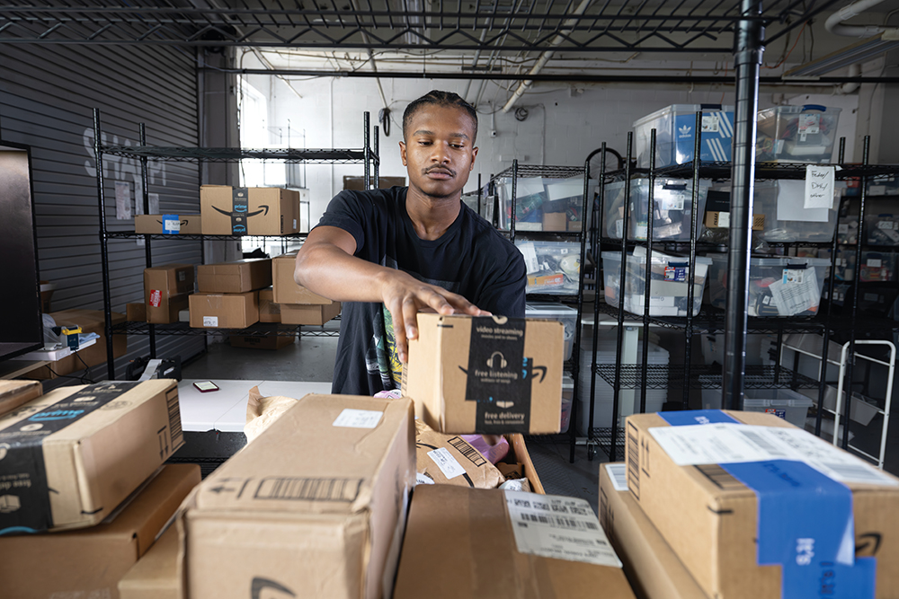 Jaylinn Humphrey sorts through shipment orders at Shappi, which operates in the INCubator in Chattanooga, TN.