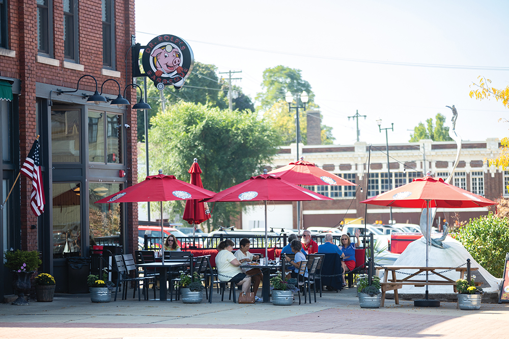 Visitors dine outdoors at Dr. Rolf's Barbeque along Western Avenue in downtown Muskegon, MI.