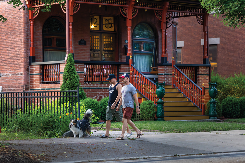 Residents walk past historic homes along Moss Avenue in Peoria, Illinois.