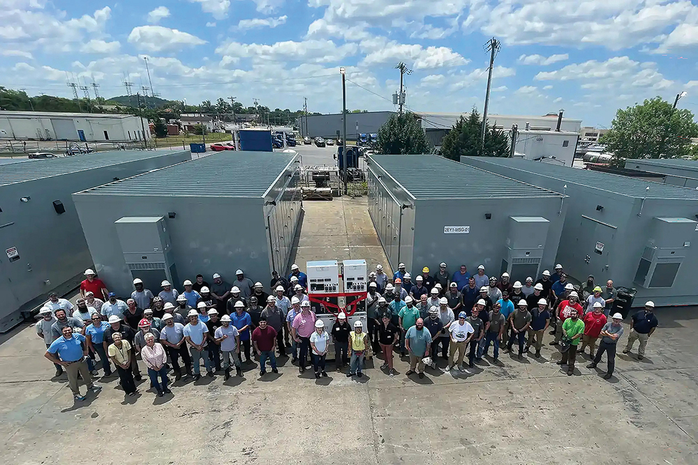 The Chattanooga team of Avail Infrastructure Solutions pose for a photo with some of the electrical enclosures they've built.