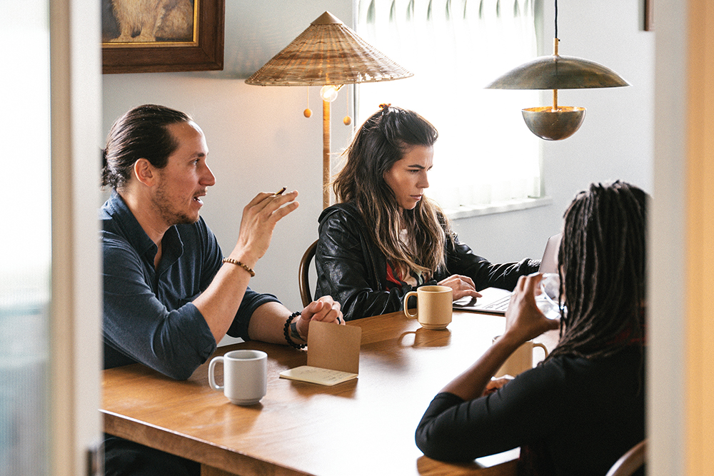People meet in a conference area at Common House, a social club located in Chattanooga’s Southside, which offers both coworking spaces and corporate memberships tailored for businesses.