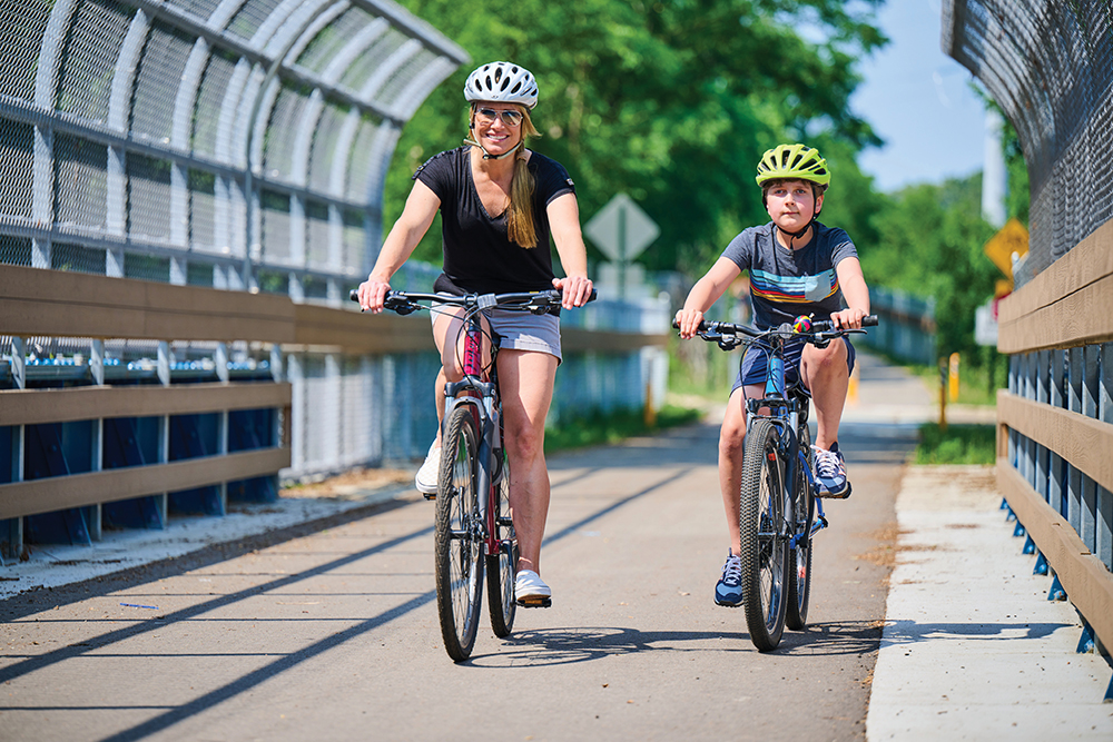 Leanne Skuse rides bikes with her son on the Rock Island Trail in Peoria, IL.