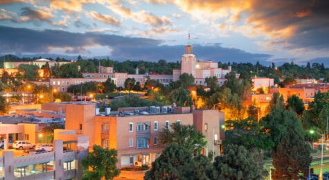 The downtown skyline of Santa Fe, New Mexico at dusk.