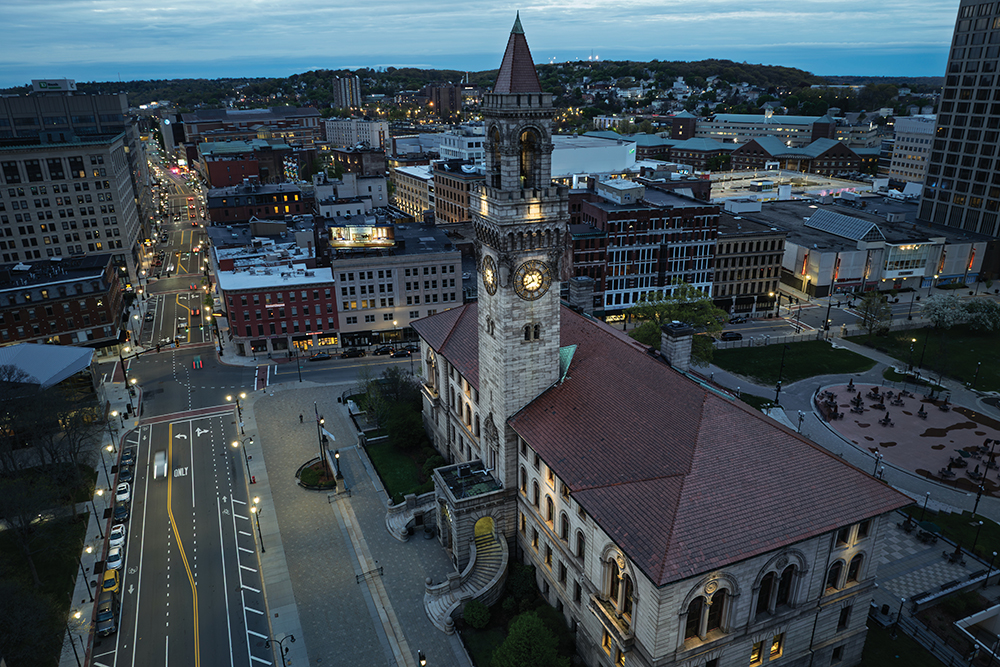 City Hall lights up at dusk in downtown Worcester, MA in this drone photo.
