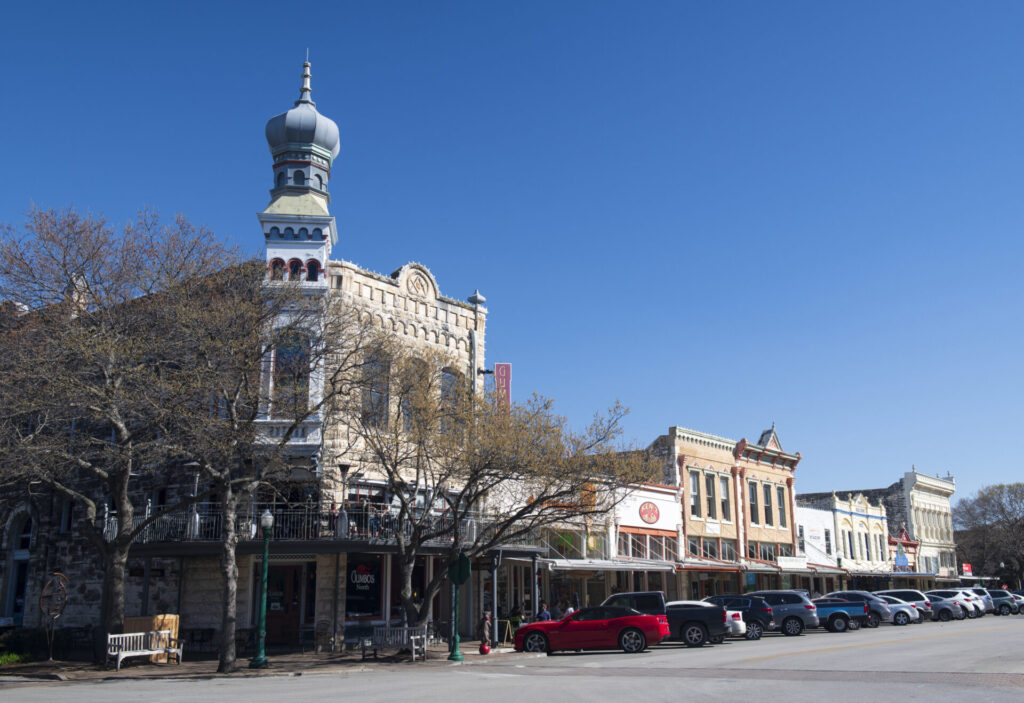Georgetown, USA - March 13, 2019. Historic buildings in downtown of Georgetown, Texas, with people on sidewalk.