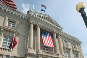 People walk past the Maury County Courthouse in downtown Columbia, TN