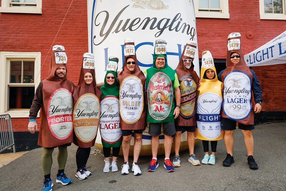 Participants wearing beer bottle costumes line up for the Yuengling Light Lager Jogger 5K in Pottsville, PA.