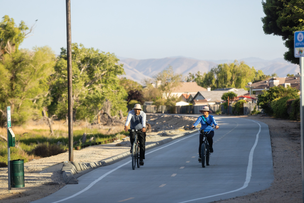 Cycling along the Mojave Riverwalk bike path and pedestrian trail in Victorville, California.