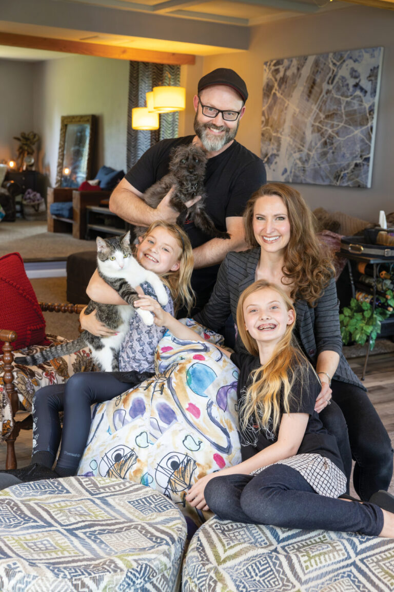 Willa, 9, left, and Larkin, 11, right, pose for a family photo with their parents Jennifer Rosa and J Scott Hinkley and the family dog and cat. The family loves living in Peoria, IL
