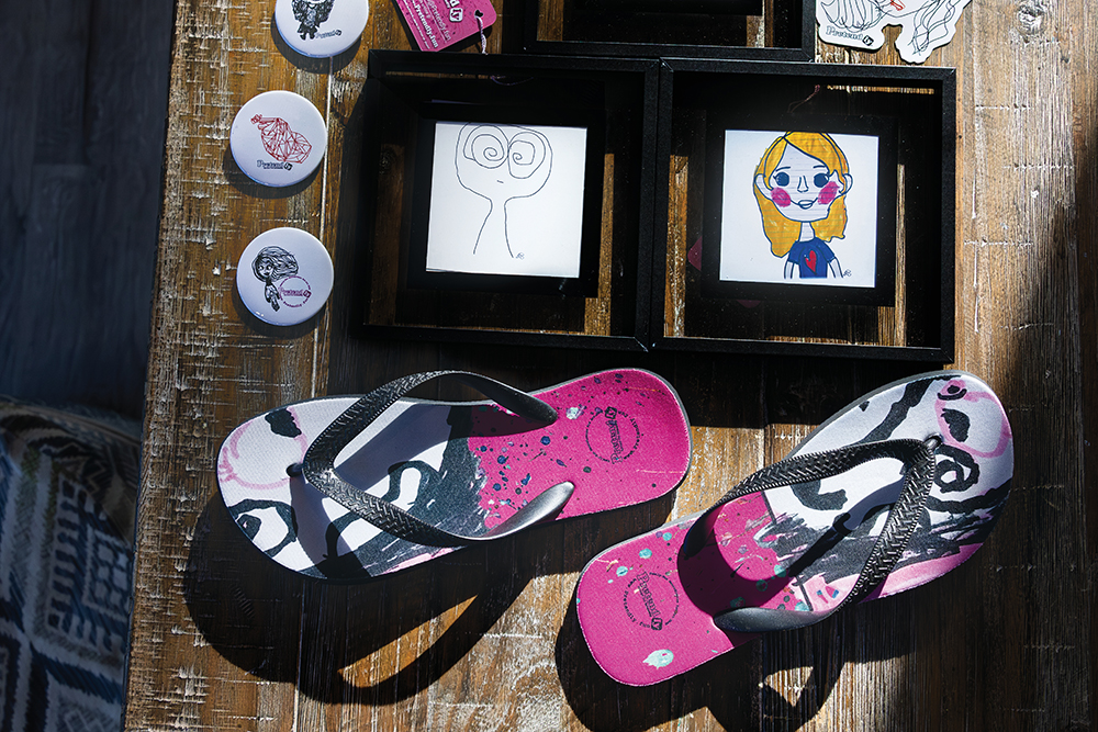 Wall prints, stickers, pins and flip flops are among the products created for Pretendly.