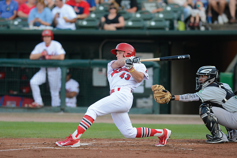 Peoria Chiefs baseball game played at Dozer Park in Peoria, IL. A Chiefs player swings during his at-bat.