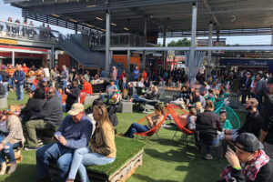 Customers gather to enjoy food and drinks at Gather GVL food hall in Greenville, SC.