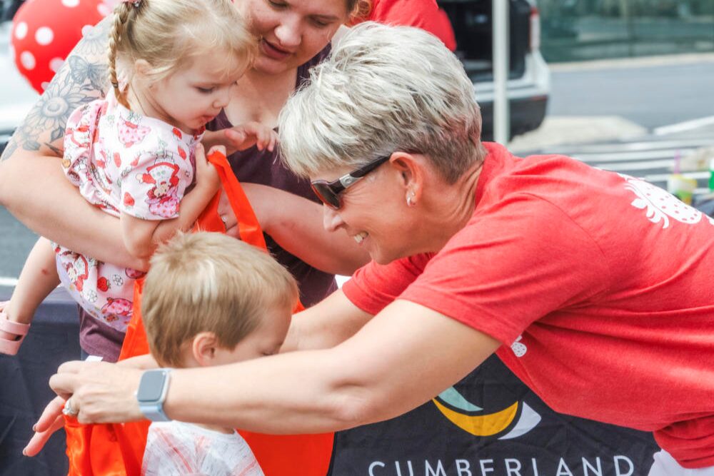 Cumberland Connect team members shared smiles and giveaways with families at the Portland Strawberry Festival in Portland, TN.