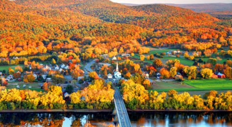 Connecticut River winding through the Poineer valley region of Massachusetts. Photo taken from a scenic viewpoint on Sugurloaf Mountain in Sunderland at dusk. The Pioneer Valley is known for its scenery and as a vacation destination and its beautiful fall foliage ranks with the best in New England