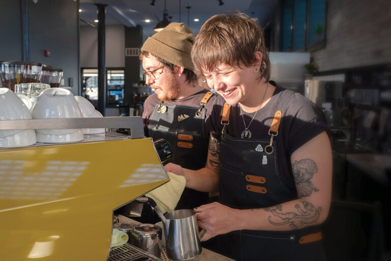 Baristas prepare coffee at Intuition Coffee in Peoria, IL.