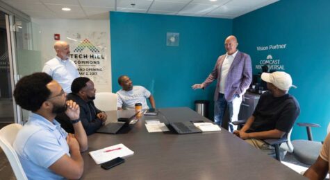Greater Nashville Technology Council President and CEO Mark Blaze, standing at right, visits with Dr. Drake Dudley, seated left, Rod McDaniel, Dr. Corey Batson and E.J. Reed, seated right, in the council’s office in Nashville.